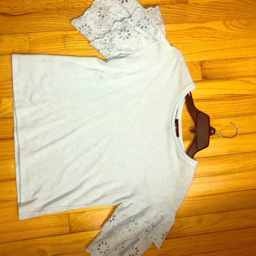 Light blue ruffled sleeve blouse